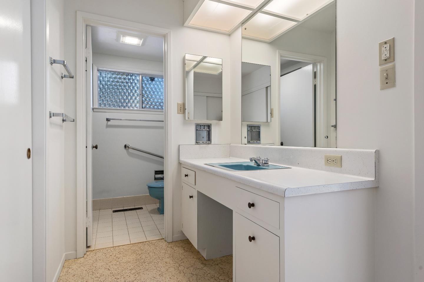 2 Lowery Drive Atherton, CA 94027 - Photo 25 of 32 a bathroom with a sink a toilet and shower