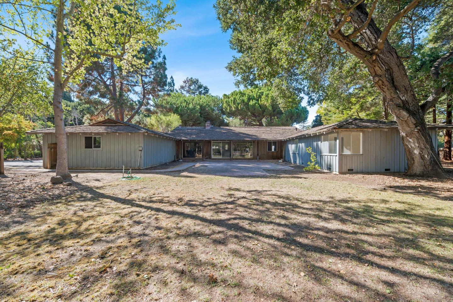 2 Lowery Drive Atherton, CA 94027 - Photo 26 of 32 a front view of a house with a yard and potted plants