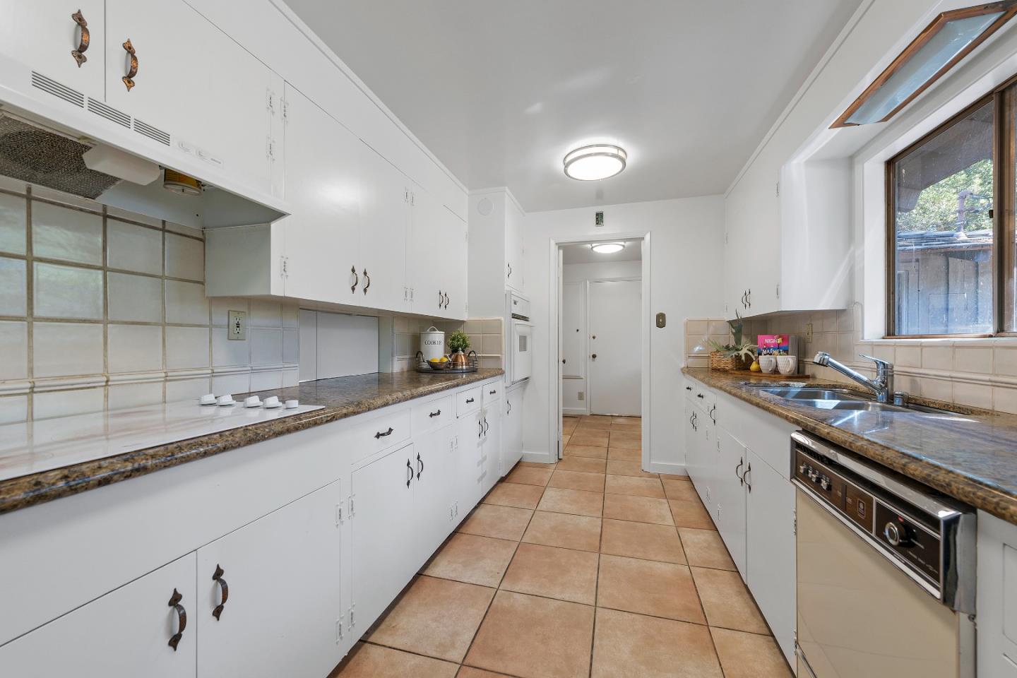 2 Lowery Drive Atherton, CA 94027 - Photo 10 of 32 a large kitchen with stainless steel appliances granite countertop a sink and a stove