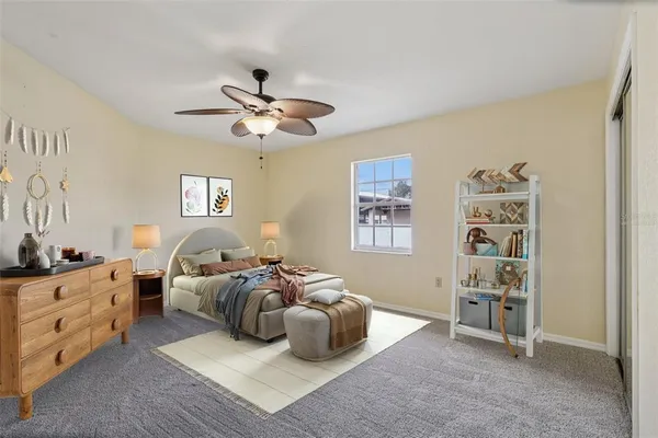 a bedroom with furniture and a window