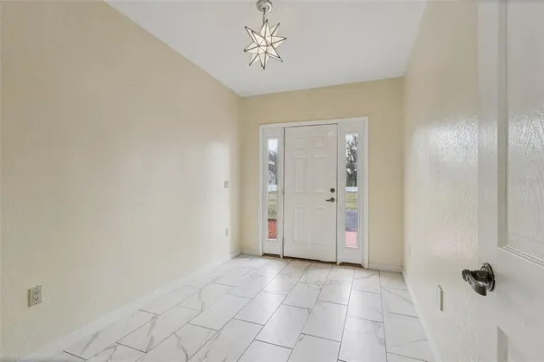 a view of an entryway with front door
