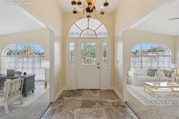 a view of a livingroom with a chandelier and living room