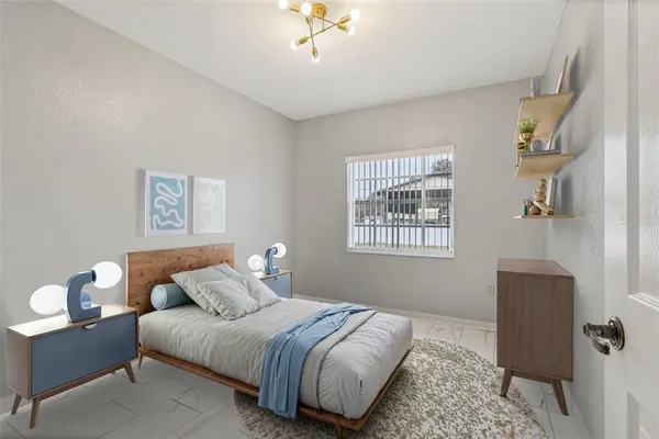 a bedroom with bed and a window