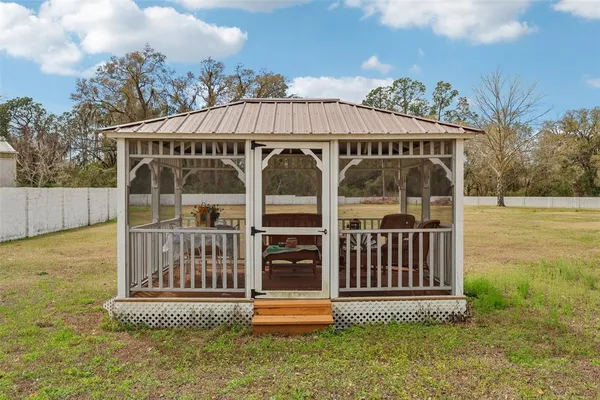 a front view of a house with a yard balcony