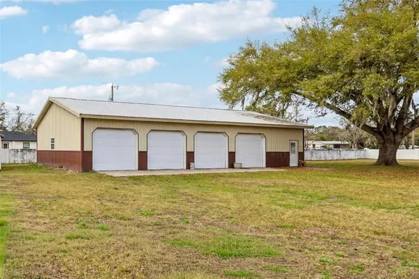 a front view of house with yard and trees