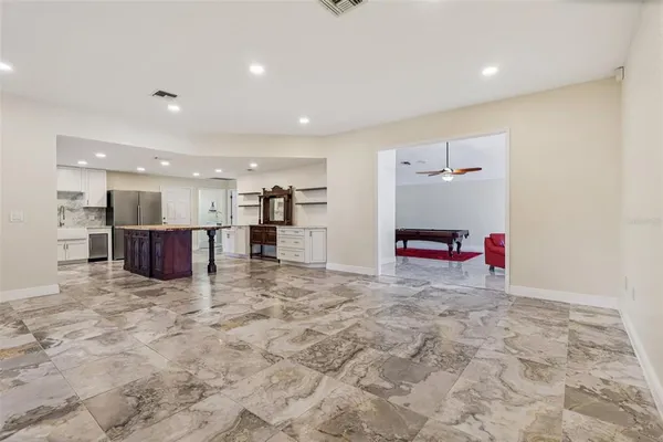 a view of a hall and an empty room