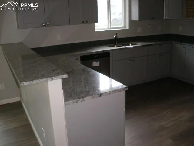 a kitchen with a sink and cabinets