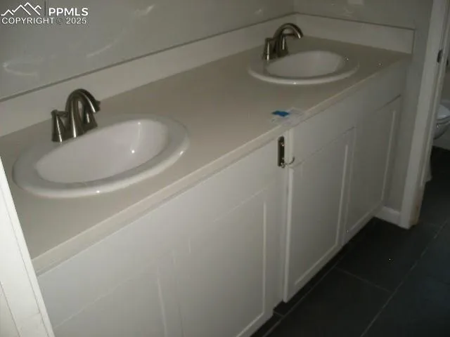 a bathroom with a sink and shower