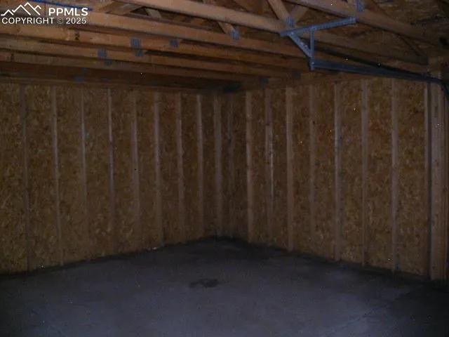 a view of a pathway with a wrought fence