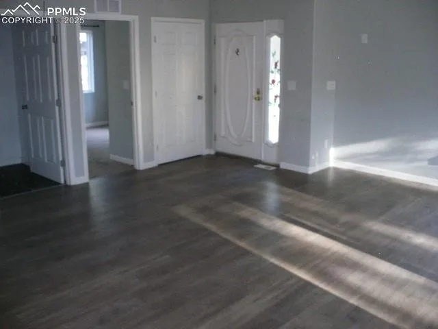 an empty room with windows