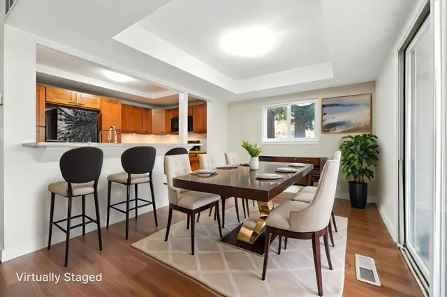 a view of a dining room with furniture and window