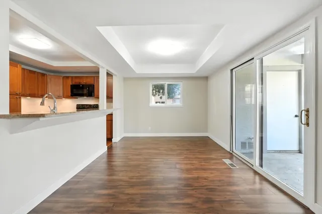 a view of a kitchen cabinets and wooden floor