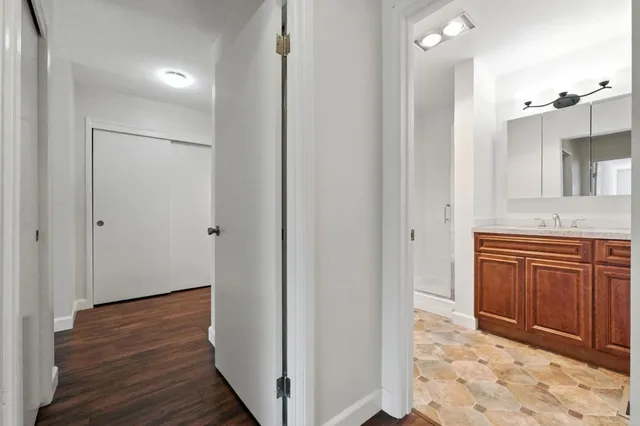 a view of a kitchen from the hallway