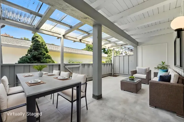 a view of a dining room with furniture window and outside view
