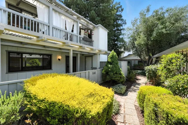 a view of a house with a swimming pool