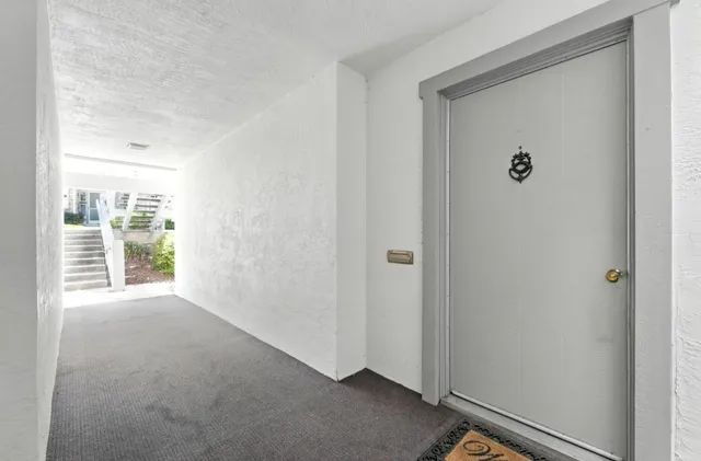 a view of a hallway with a window