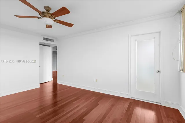 a view of a kitchen with a sink dishwasher oven window and wooden floor