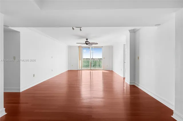 a kitchen with stainless steel appliances granite countertop a refrigerator and cabinets
