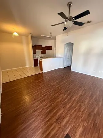 a view of a kitchen with a dishwasher and wooden floor