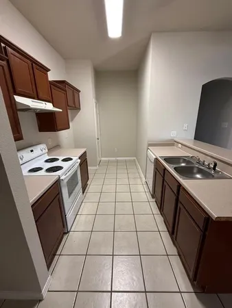 a kitchen with a stove and a microwave