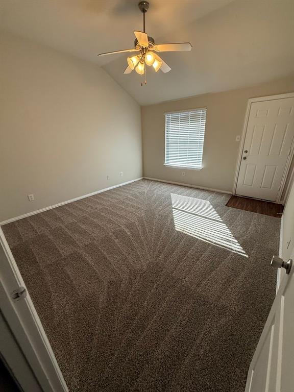 5540 Homestead Road Arlington, TX 76017 - Photo 5 of 11 a view of a bedroom with a ceiling fan and a window