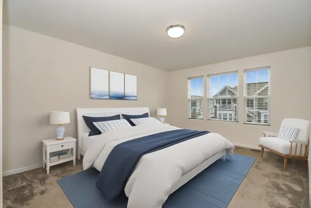 a bedroom with a bed and a couch