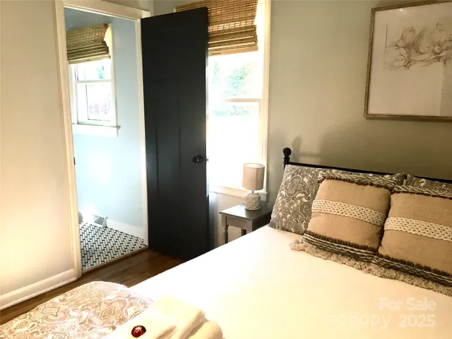 a bedroom with a bed and window