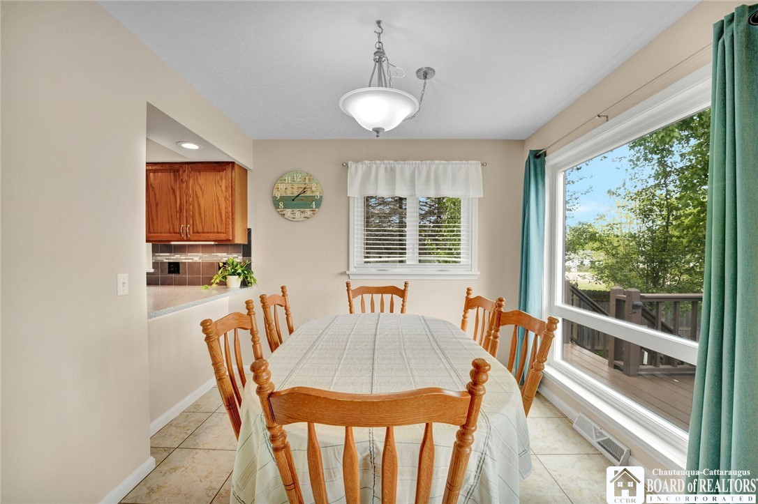4406 West Lake Road, Unit 24 Chautauqua, NY 14757 - Photo 16 of 42 Dining room with oak dining table and chairs inclu