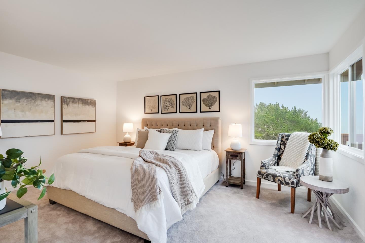 1238 Park Pacifica Avenue Pacifica, CA 94044 - Photo 17 of 32 a bedroom with a bed and a large window