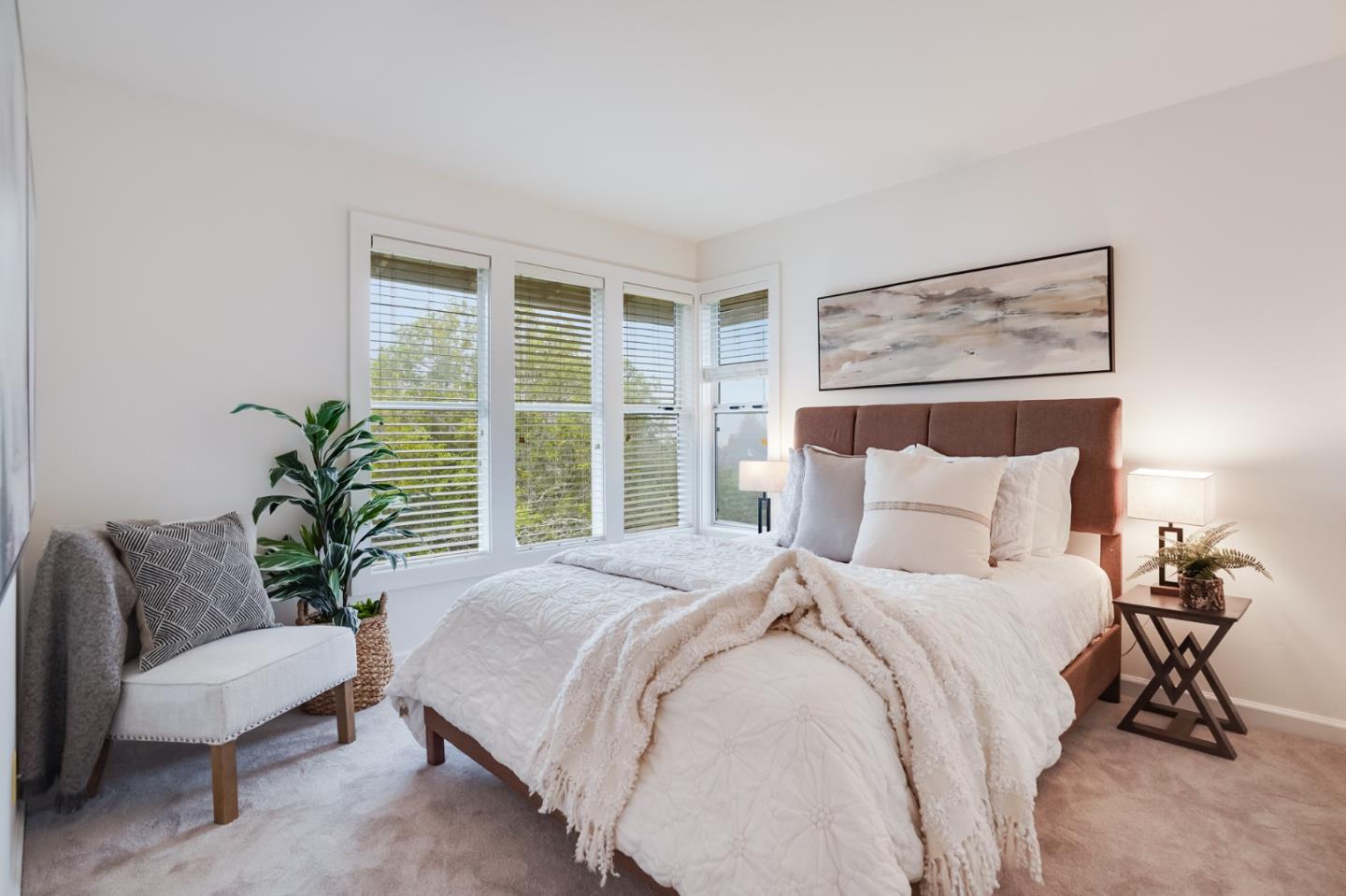 1238 Park Pacifica Avenue Pacifica, CA 94044 - Photo 20 of 32 a bedroom with a large bed and a potted plant