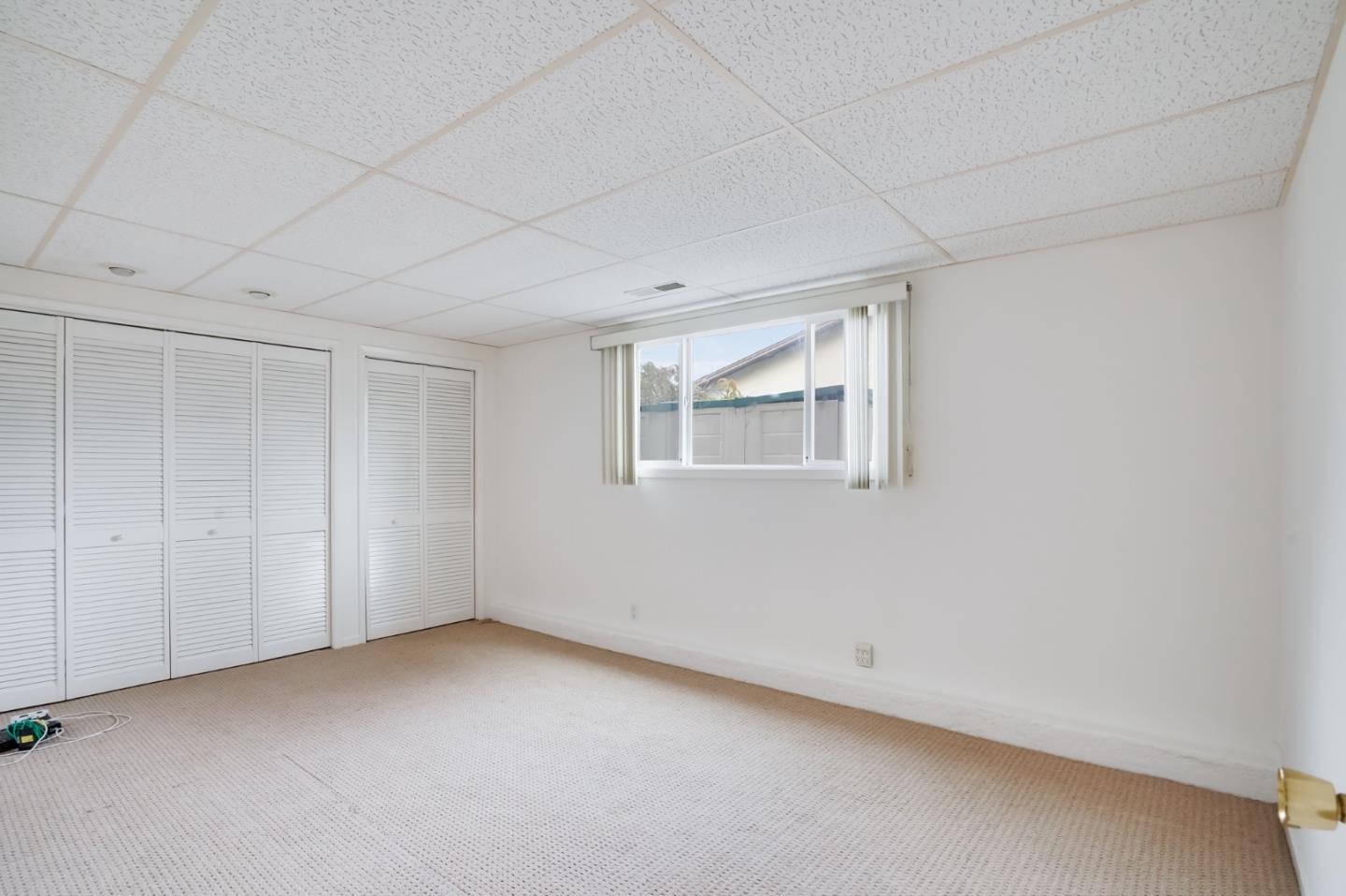 1238 Park Pacifica Avenue Pacifica, CA 94044 - Photo 27 of 32 a view of an empty room with a window