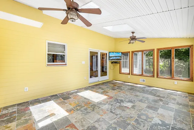 a bathroom with a large window and swimming pool