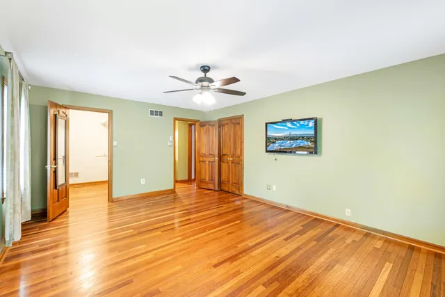 a bathroom with a window and a shower curtain