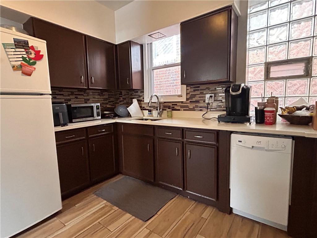 2150 Wightman Street Pittsburgh, PA 15217 - Photo 16 of 25 a kitchen with a sink stove and cabinets