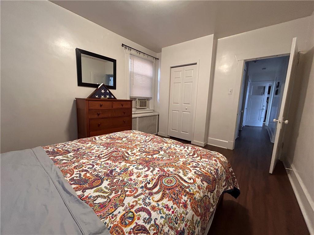 2150 Wightman Street Pittsburgh, PA 15217 - Photo 23 of 25 a bedroom with a bed and a flat tv screen on dresser