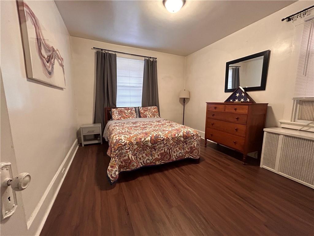 2150 Wightman Street Pittsburgh, PA 15217 - Photo 24 of 25 a bedroom with a bed and wooden floor