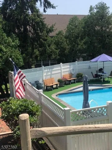 a view of a wooden deck and a yard