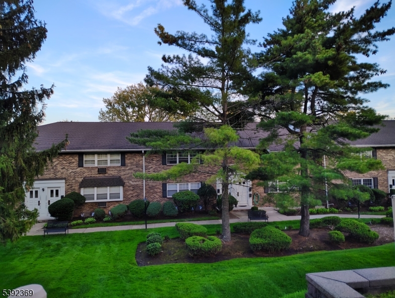 54 East Maple Street Teaneck, NJ 07666 - Photo 17 of 17 a view of a big house with a big yard and large tree