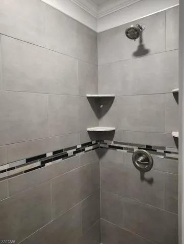 a bathroom with a window and a bath tub