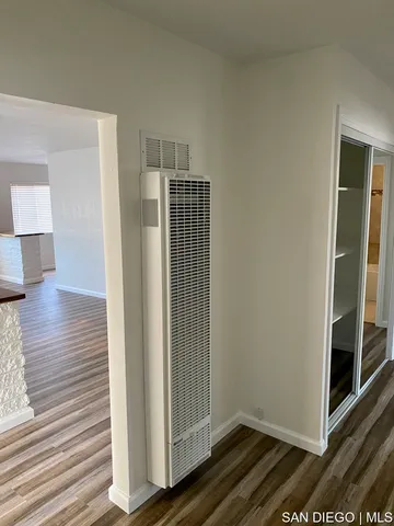 an empty room with an empty space and closet