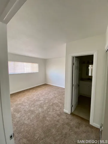 an empty room with closet area