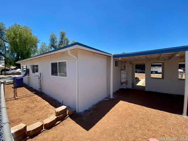 a backyard of a house with seating space