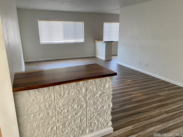 a view of gallery with wooden floor