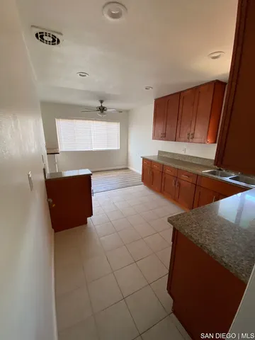 a view of storage and utility room with closet