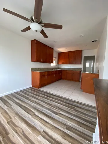 a view of a livingroom with an empty space and a fireplace