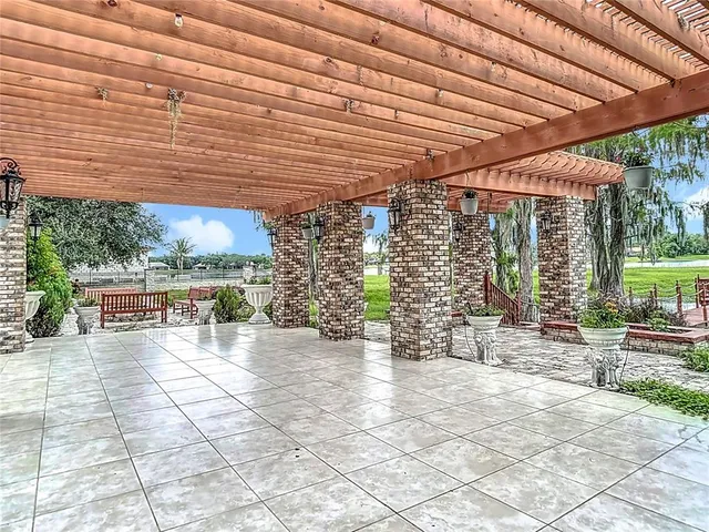 a bathroom with double vanity sinks a vanity a lamp and a mirror