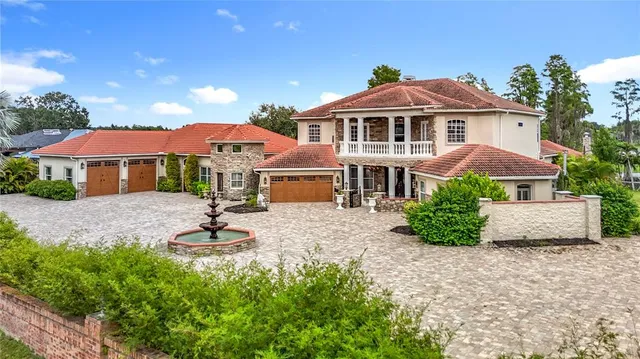 a bedroom with a large bed and a flat tv screen on dresser
