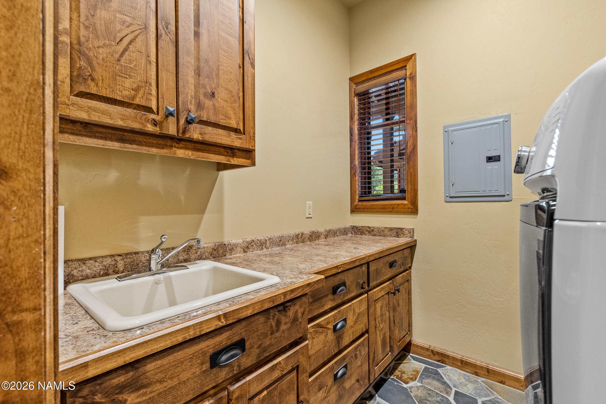 2214 East Del Rae Drive Flagstaff, AZ 86005 - Photo 32 of 45 a bathroom with a granite countertop sink and a mirror