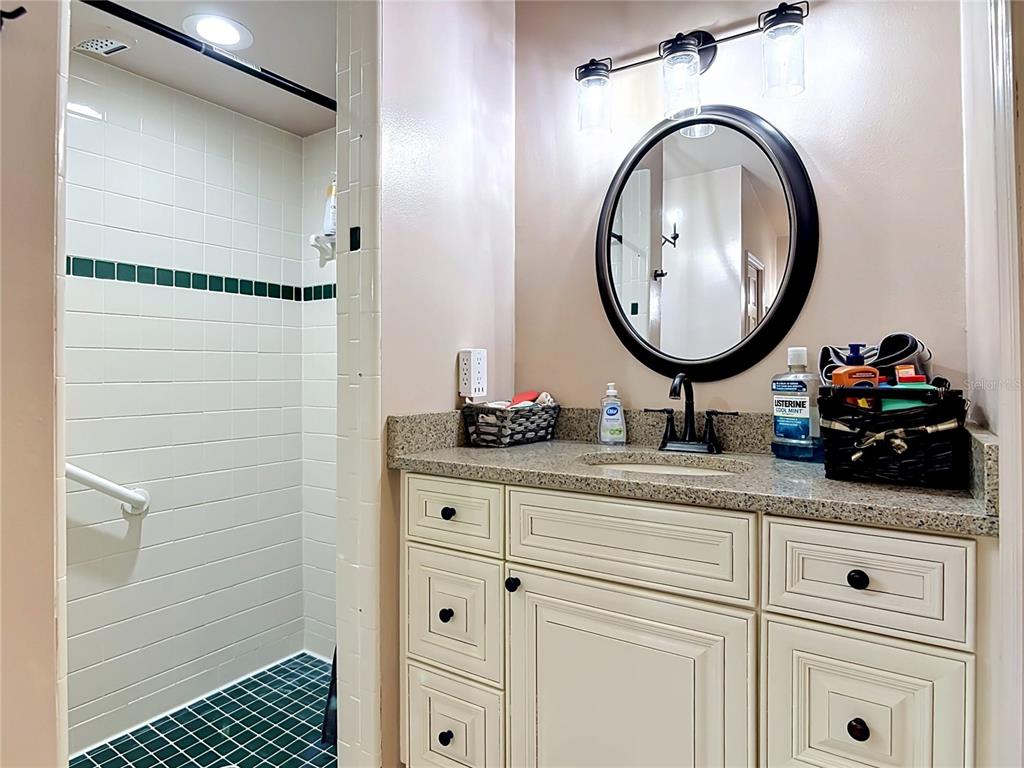 1395 Maytown Road Osteen, FL 32764 - Photo 37 of 65 a bathroom with a sink and a mirror