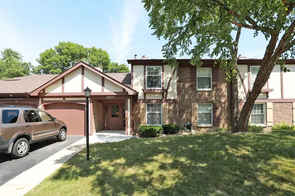 a view of a house with a back yard